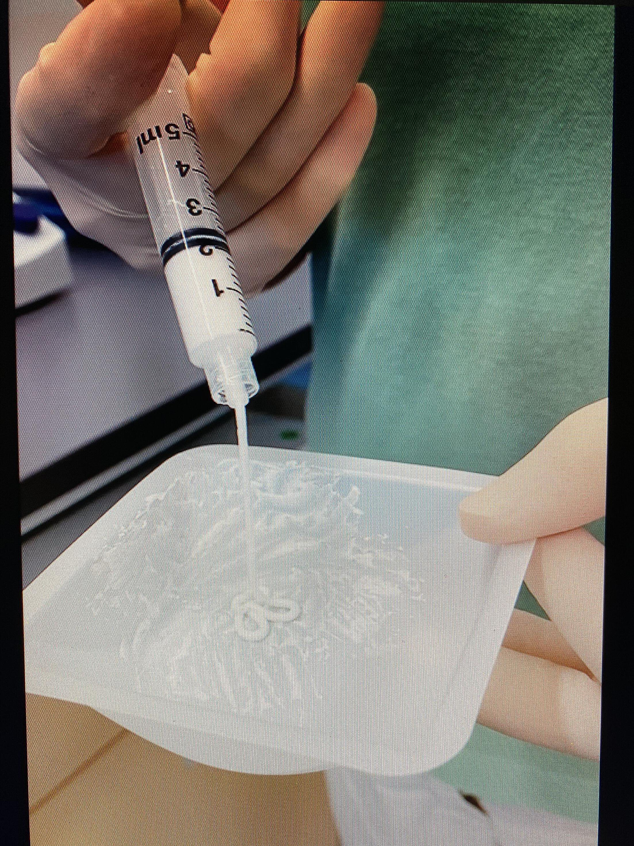 Fig. 1 
            A photo of the PVA-VAN/TOB-PDCPD paste showing its white colour and its injectability.
          