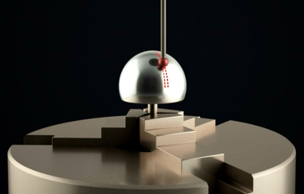 Fig. 1 
            A graphic representation of a
metallic hip resurfacing component undergoing CMM examination. The
ruby probe makes several linear traces from equator to pole: known
as contours. In the image, the CMM has completed one contour trace
and is midway through the second. Each dashed line represents a
measurement point. The distance in millimetres between each point
in the contour is known as the point pitch.
          